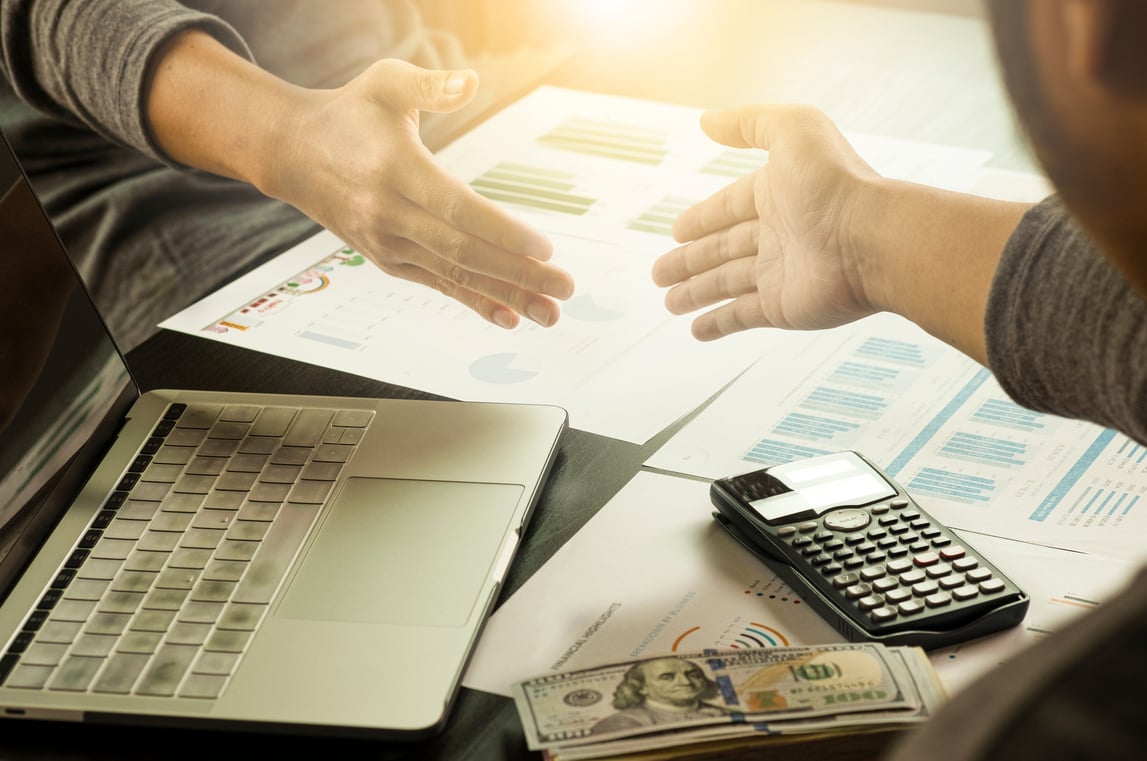 Businessman gesture shaking hand  for successful dealing negotiation. They achieve  and enjoy with marketing business meeting between supplier and customer.